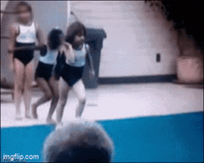 Woman In White Leotard Performing GIF