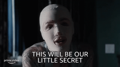 Woman In White Mask Says Little Secret GIF