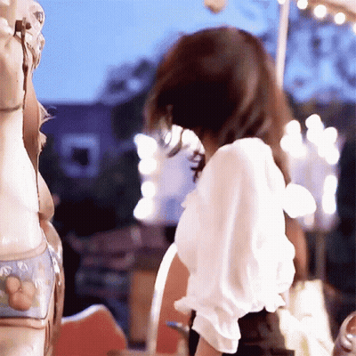 Woman In White Riding Merry Go Round GIF