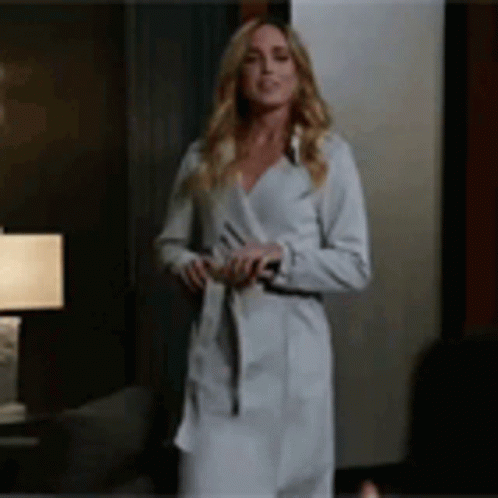 Woman In White Robe And Coat GIF