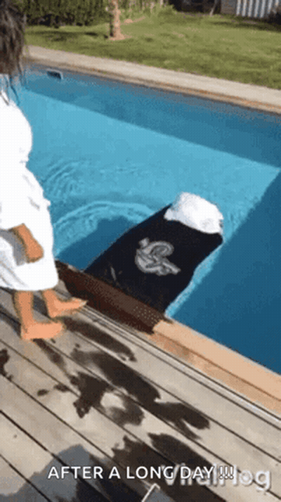 Woman In White Robe By Pool GIF