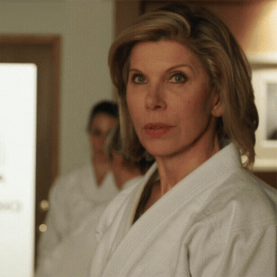 Woman in White Robe Looking at Camera