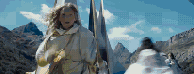 Woman In White Robe Running In Mountains Holding Flag GIF