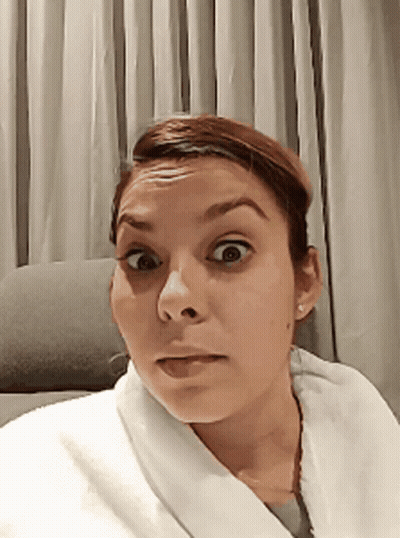 Woman In White Robe Surprised GIF