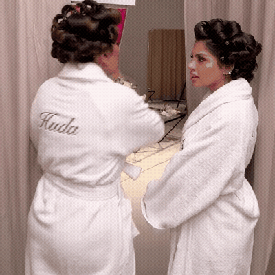 Woman In White Robe With Kuda GIF