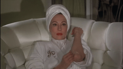Woman In White Robe With Letter J GIF