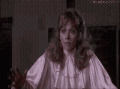 Woman In White Satin Blouse Making Funny Face GIF