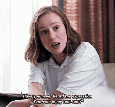 Woman In White Saying Yum-Yum In My Tum-Tum GIF
