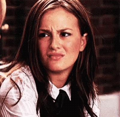 Woman In White Shirt And Black Tie Making Funny Face GIF