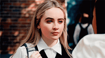 Woman In White Shirt And Black Vest GIF