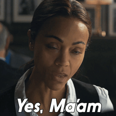 Woman In White Shirt And Black Vest Says Yes Maam GIF