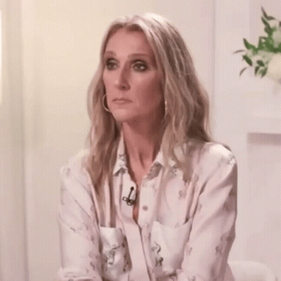 Woman In White Shirt And Hoop Earrings Hands Outstretched GIF