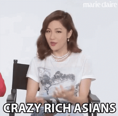 Woman In White Shirt And Pearl Necklace Talking GIF