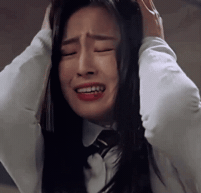Woman In White Shirt And Tie Crying Covering Ears GIF