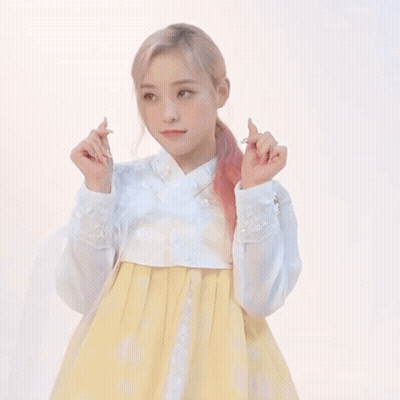 Woman In White Shirt And Yellow Skirt Making Funny Face GIF