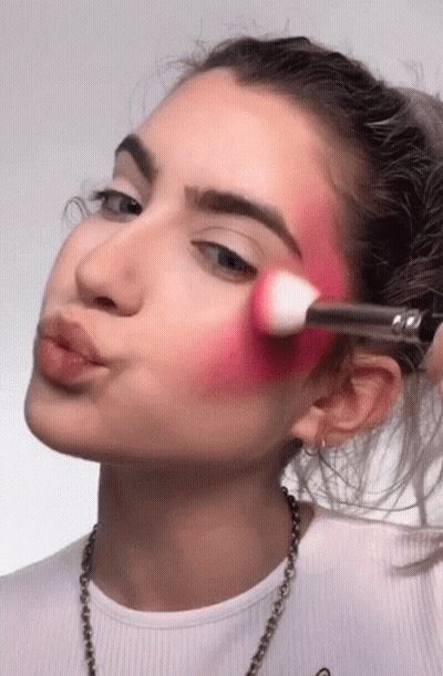 Woman In White Shirt Applying Makeup GIF
