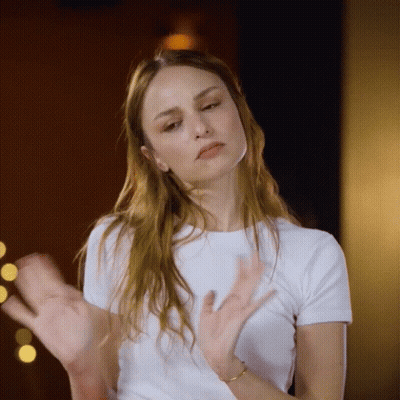 Woman in White Shirt Clapping Hands