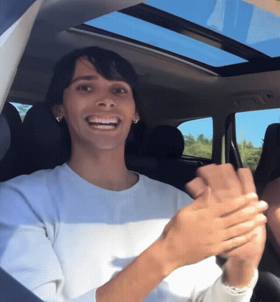 Woman In White Shirt Clapping In Car GIF