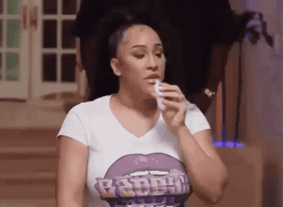 Woman In White Shirt Holding Tissue To Face GIF
