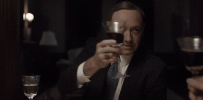 Woman In White Shirt Holding Wine Glass GIF