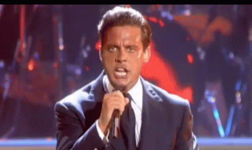 Woman In White Shirt In Front Of Crowd And Talent Sign GIF