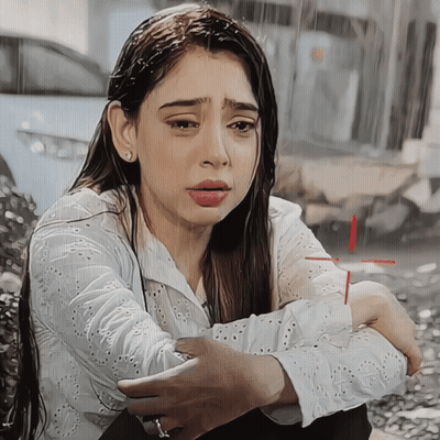 Woman In White Shirt Kneeling In Rain GIF