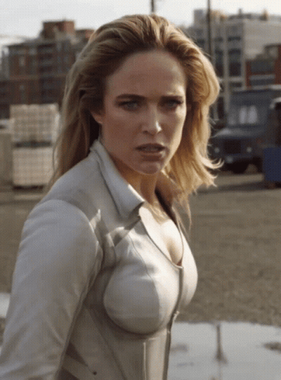 Woman In White Shirt Looking At Camera GIF
