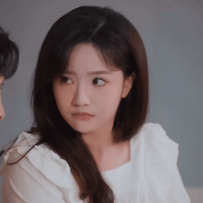 Woman In White Shirt Looking At Man GIF