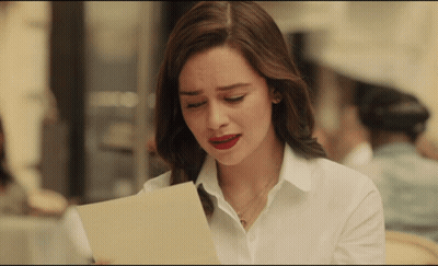 Woman In White Shirt Looking At Paper GIF