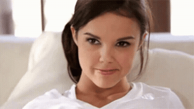 Woman In White Shirt Making Funny Face GIF