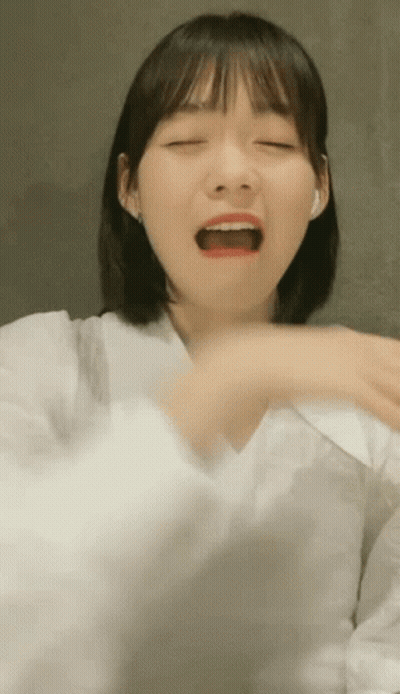 Woman In White Shirt Making Funny Face GIF