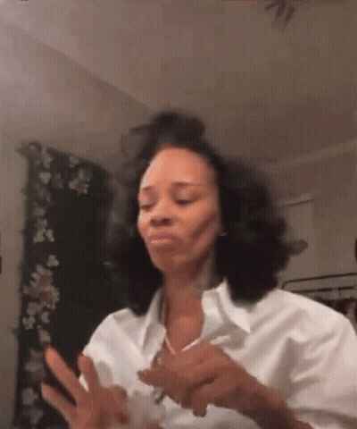 Woman In White Shirt Making Funny Face With Cell Phone GIF