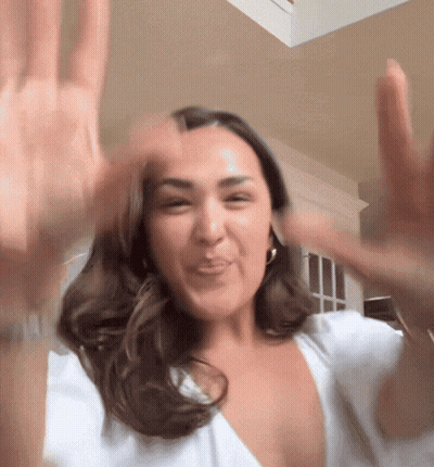 Woman In White Shirt Making Funny Face GIF