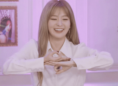 Woman In White Shirt Making Hand Heart GIF