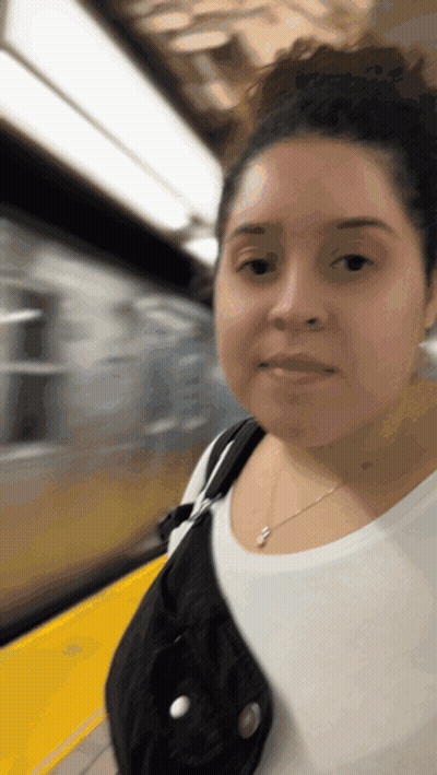 Woman In White Shirt On Train Platform GIF