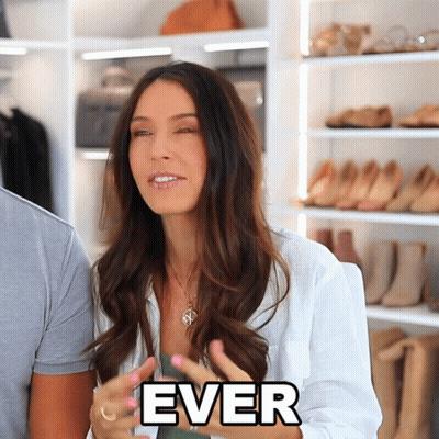 Woman In White Shirt Saying Ever In Front Of Closet Full Of Shoes GIF