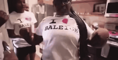 Woman in White Shirt Saying I Love Baleah