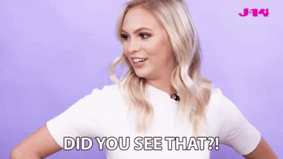 Woman In White Shirt Says Did You See That On Purple Background GIF