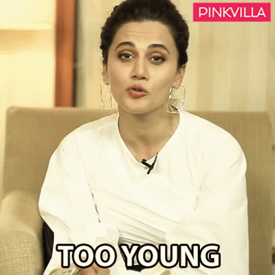 Woman In White Shirt Sitting On Couch Saying Too Young GIF