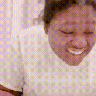Woman in White Shirt Smiling Eyes Closed