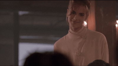 Woman In White Shirt Smiling In Front Of Group GIF