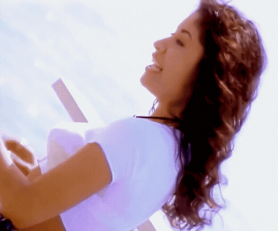 Woman In White Shirt Smiling Looking Aside GIF
