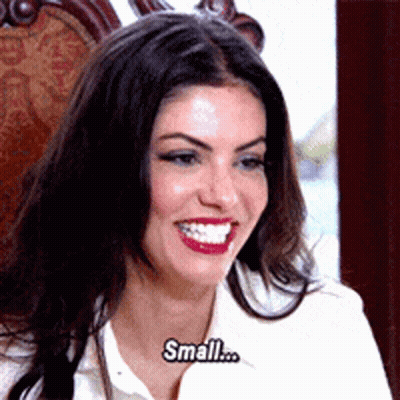 Woman In White Shirt Smiling Saying Small GIF