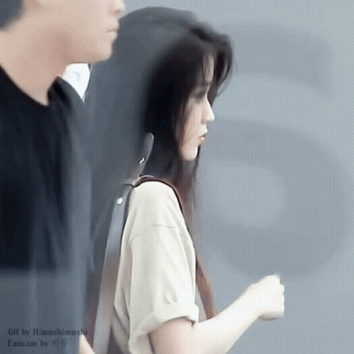 Woman In White Shirt Standing With Man GIF