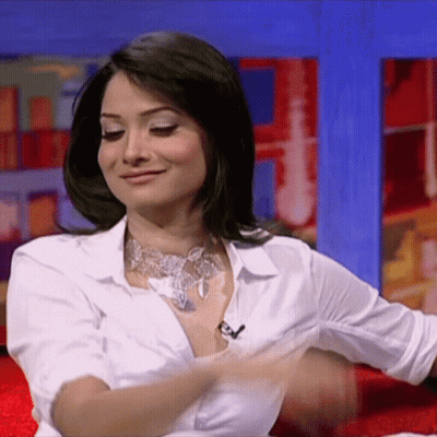 Woman In White Shirt Taking Off Shirt GIF