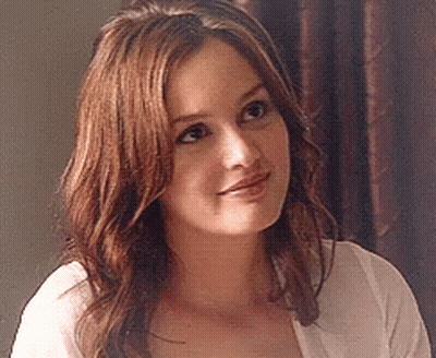 Woman In White Shirt With Long Brown Hair Smiling GIF