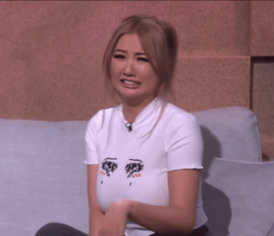 Woman In White Shirt With Two Eyes Drawing On Couch GIF