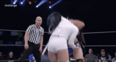 Woman In White Shorts Wrestling Man In Striped Shirt In Ring GIF