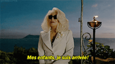 Woman In White Suit And Sunglasses Says Mes Enfants GIF