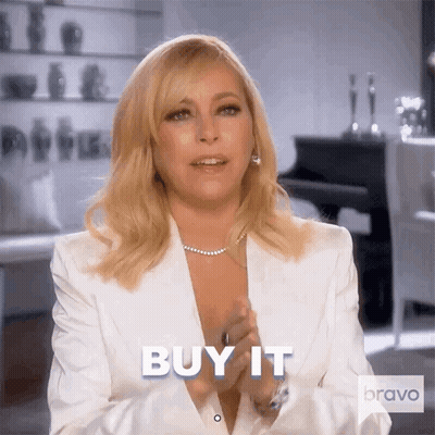 Woman In White Suit Clapping Saying Buy It GIF